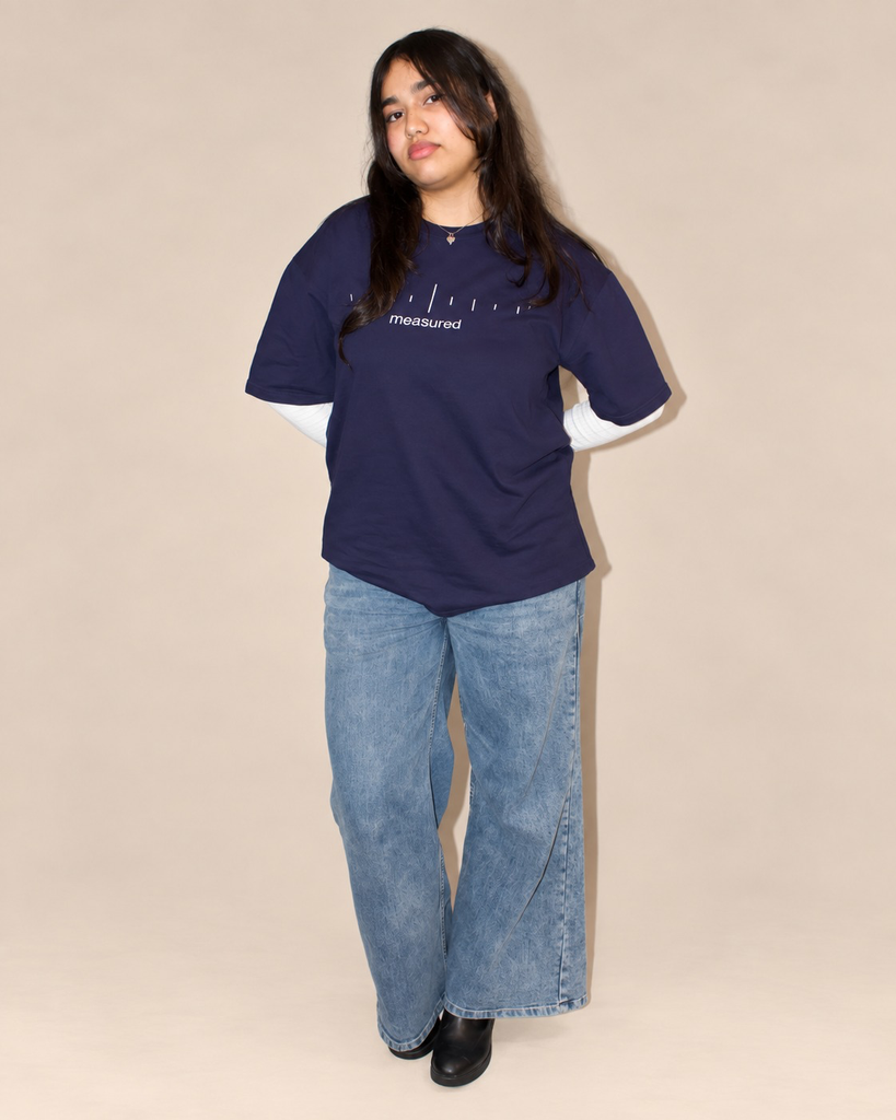 19_studio_portrait_photo_with_a_plain_beige_cream_bac.webp